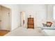 Bedroom with neutral carpet, a bed, a desk with a chair and access to other rooms at 1021 Isleworth Ave, Charlotte, NC 28203