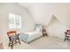 Bedroom with neutral carpet, a bed, and a window with natural light and shutter detail at 1021 Isleworth Ave, Charlotte, NC 28203
