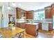 Traditional kitchen with wood cabinetry, island, breakfast nook, and white countertops, perfect for Gathering gatherings and entertaining at 1021 Isleworth Ave, Charlotte, NC 28203