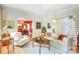 Cozy living room with hardwood floors, neutral sofas, fireplace, and a glimpse of the dining area and staircase at 1021 Isleworth Ave, Charlotte, NC 28203