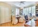 Office with wood flooring, round table with chairs, built-in shelving, and natural light at 1021 Isleworth Ave, Charlotte, NC 28203