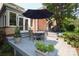 Cozy outdoor patio with dining set, perfect for entertaining or relaxing at 1021 Isleworth Ave, Charlotte, NC 28203