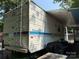 Side view of a Prowler camper with ladder and extended awning at 103 Powder Horn Trl, Mount Gilead, NC 27306
