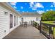 Exterior back deck with furniture, a white exterior, and manicured landscaping create a comfortable space at 106 Laren Rd, Shelby, NC 28152