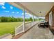 Charming covered porch with rocking chairs and scenic views of the expansive front yard at 106 Laren Rd, Shelby, NC 28152