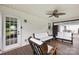 A covered porch has plenty of seating with a fan and view to the backyard at 106 Laren Rd, Shelby, NC 28152