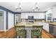 Kitchen showcasing a center island with bar seating, granite countertops, stainless steel appliances, and white cabinets at 106 Laren Rd, Shelby, NC 28152