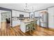 Bright kitchen with white cabinetry, stainless steel appliances, granite countertops, and a kitchen island with barstools at 106 Laren Rd, Shelby, NC 28152