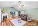 Cozy living room featuring a fireplace, TV, and hardwood floors at 106 Laren Rd, Shelby, NC 28152