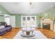 Spacious living room with a fireplace, French doors, and hardwood floors at 106 Laren Rd, Shelby, NC 28152