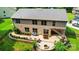Aerial view of a backyard with patio, fire pit, and lush landscaping at 110 St Sophia Ct, Mooresville, NC 28117
