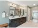 Bathroom with double vanity, dark cabinets, modern lighting, and sleek fixtures at 110 St Sophia Ct, Mooresville, NC 28117