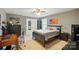 Comfortable bedroom featuring neutral tones, a study desk, and ample natural light at 110 St Sophia Ct, Mooresville, NC 28117