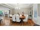 Formal dining room with hardwood floors, chandelier, and views into the kitchen, ideal for entertaining at 110 St Sophia Ct, Mooresville, NC 28117