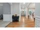 Welcoming foyer featuring hardwood floors, elegant wainscoting, and a view into the adjoining living spaces at 110 St Sophia Ct, Mooresville, NC 28117