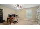 Office space with natural light, ceiling fan, desk, and ample storage at 110 St Sophia Ct, Mooresville, NC 28117