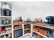 Well-organized pantry with shelving, cabinets, and beverage cooler for ample storage and convenience at 110 St Sophia Ct, Mooresville, NC 28117