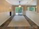 Bright dining room with large sliding glass doors to the outdoor deck and decorative lighting at 12092 Spinnaker Dr, Fort Mill, SC 29708