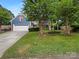 Beautiful blue two-story home with a two-car garage and a well-kept lawn at 12092 Spinnaker Dr, Fort Mill, SC 29708