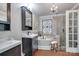 Bathroom showcasing dual vanities, tile floors, a standalone tub, and a glass shower at 12311 Bentcreek Ln, Matthews, NC 28105