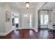 Welcoming foyer with hardwood floors and a view of the adjacent dining room and living spaces at 12311 Bentcreek Ln, Matthews, NC 28105