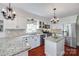 Bright kitchen with white cabinets, granite countertops, and stainless steel appliances at 12311 Bentcreek Ln, Matthews, NC 28105
