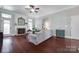 Bright living room with fireplace, hardwood floors, and neutral color palette at 12311 Bentcreek Ln, Matthews, NC 28105