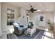 Inviting sunroom with tile floors, a ceiling fan, and a brick fireplace at 12311 Bentcreek Ln, Matthews, NC 28105