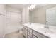 Full bathroom featuring double sinks, a shower-tub combo, and neutral tile flooring at 150 Haddonsfield Dr, Mooresville, NC 28115