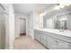 Bathroom with double vanity, grey cabinets, and large mirrors at 150 Haddonsfield Dr, Mooresville, NC 28115