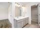 Bathroom featuring double sinks, gray cabinets, white countertops, and tile flooring at 150 Haddonsfield Dr, Mooresville, NC 28115