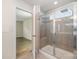 Tiled shower with glass door in Primary bathroom at 150 Haddonsfield Dr, Mooresville, NC 28115