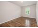 Bedroom with hardwood floors and a window with shutters at 150 Haddonsfield Dr, Mooresville, NC 28115
