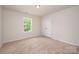 Bedroom with carpet flooring, a window that provides natural light and a double door closet at 150 Haddonsfield Dr, Mooresville, NC 28115
