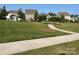 View of the community park with sidewalks, mature trees and a gazebo at 150 Haddonsfield Dr, Mooresville, NC 28115