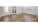 An elegant dining room with hardwood floors and wainscoting at 150 Haddonsfield Dr, Mooresville, NC 28115