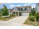Charming two-story home with a well-manicured lawn and two-car garage at 150 Haddonsfield Dr, Mooresville, NC 28115