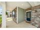 A welcoming front porch featuring stone accents and a stylish front door at 150 Haddonsfield Dr, Mooresville, NC 28115