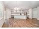 Spacious kitchen boasts modern appliances, gray cabinetry, and an island with quartz counters at 150 Haddonsfield Dr, Mooresville, NC 28115