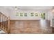 A spacious living room featuring beautiful hardwood floors and lots of natural light at 150 Haddonsfield Dr, Mooresville, NC 28115