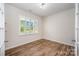 A well-lit office space with hardwood floors and plantation shutters at 150 Haddonsfield Dr, Mooresville, NC 28115