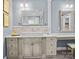 Bathroom features a vessel sink, vanity with drawers, framed mirror, and a make up vanity with stool at 150 Pinnacle Shores Dr, Mooresville, NC 28117