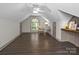Bright bonus room featuring window nook and desk space with dark wood floors at 150 Pinnacle Shores Dr, Mooresville, NC 28117