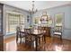 Elegant dining room featuring hardwood floors, a large window, and classic decor at 150 Pinnacle Shores Dr, Mooresville, NC 28117