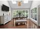 Light filled dining room with skylights, large windows, and hardwood floors at 150 Pinnacle Shores Dr, Mooresville, NC 28117