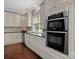 Bright kitchen features stainless steel appliances, granite countertops, and custom cabinetry at 150 Pinnacle Shores Dr, Mooresville, NC 28117