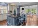 Stylish kitchen with a large island, granite countertops, stainless steel appliances, and hardwood floors at 150 Pinnacle Shores Dr, Mooresville, NC 28117