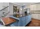 Kitchen with a center island and bar seating conveniently located by the staircase at 150 Pinnacle Shores Dr, Mooresville, NC 28117