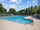 Inviting community pool area with lounge chairs for relaxation on a sunny day at 150 Pinnacle Shores Dr, Mooresville, NC 28117