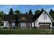 A charming single-Gathering home featuring stone accents, a welcoming porch, and an attached two-car garage at 1676 Parkside Dr, Catawba, NC 28609